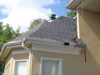 Technicians evaluating a commercial roof condition in New York