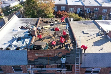 Roofing contractor reviewing roof conditions and repair scope notes